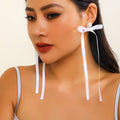 Exaggerated Fabric Tassel Bow Earrings with Pearl & Crystal Flower Studs - Alba Vaga