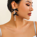 Exaggerated Fabric Tassel Bow Earrings with Pearl & Crystal Flower Studs - Alba Vaga