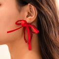 Exaggerated Fabric Tassel Bow Earrings with Pearl & Crystal Flower Studs - Alba Vaga